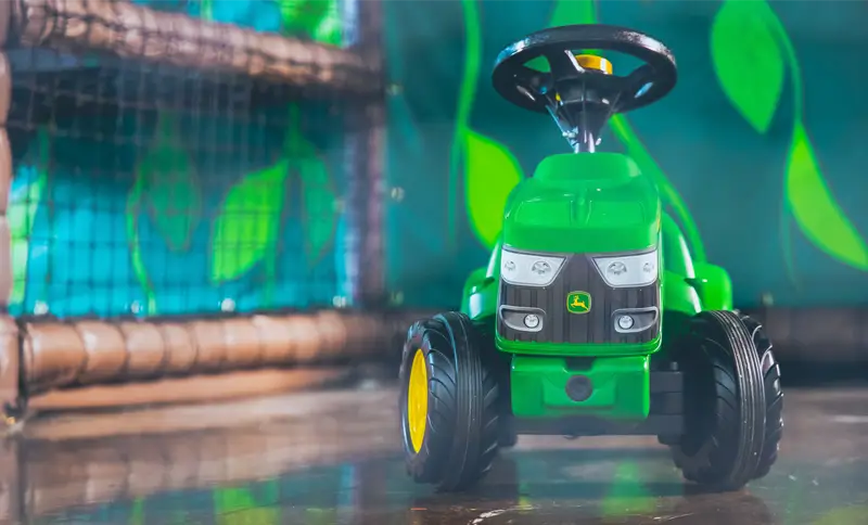 Green-John-Deere-ride-on-toy-at-Northampton-Kids-park