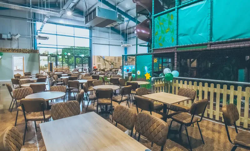 Large-group-of-tables-and-chairs-in-kids-softplay-in-Flore
